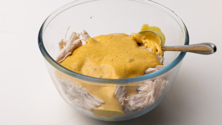 Mixing coronation chicken