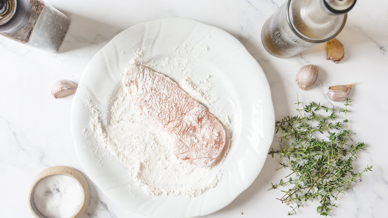 Chicken in flour on plate