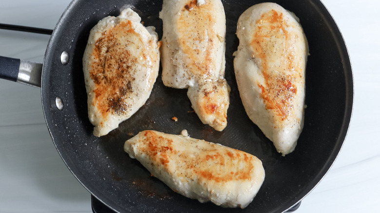 seared chicken breasts in skillet