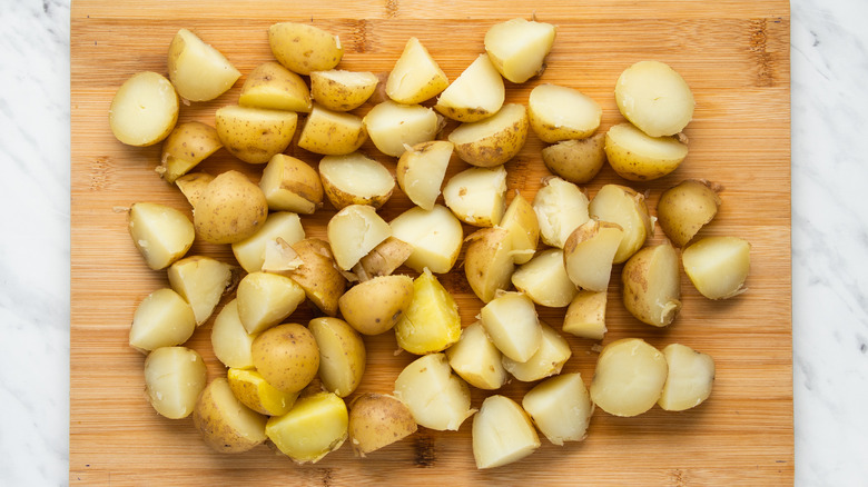 potatoes on cutting board 