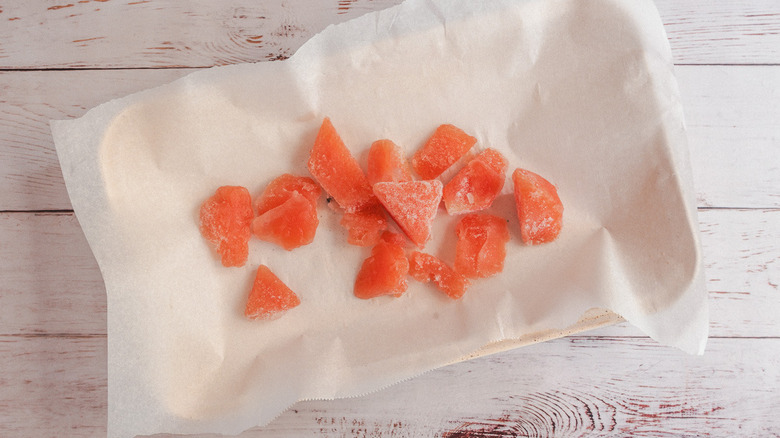 frozen watermelon pieces on baking sheet