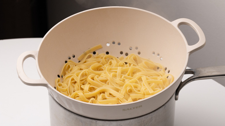 drained fettuccine in a colander