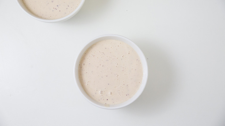 peach smoothie in white bowls