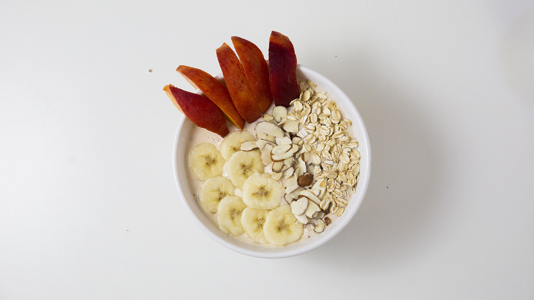 peach smoothie bowl on table