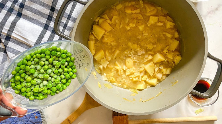 adding peas to pot