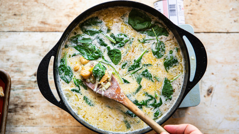 Pot of soup with spinach