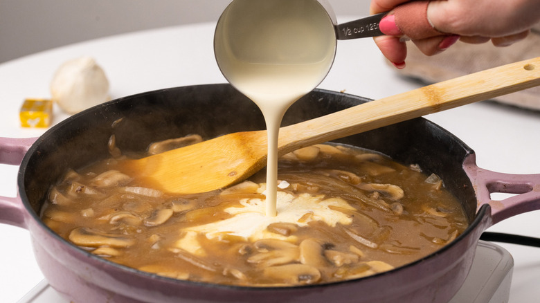 cream pouring into pan