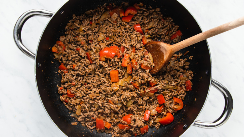 beef and red pepper in pan