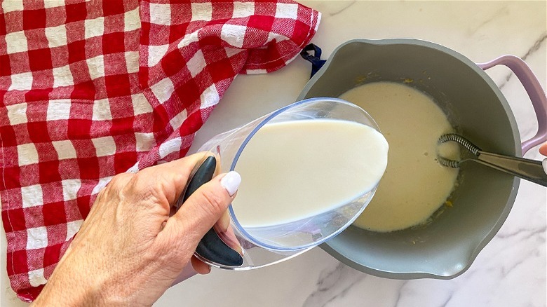 measuring cup with milk 