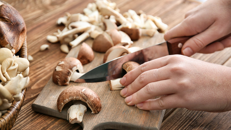 chopping cremini mushrooms