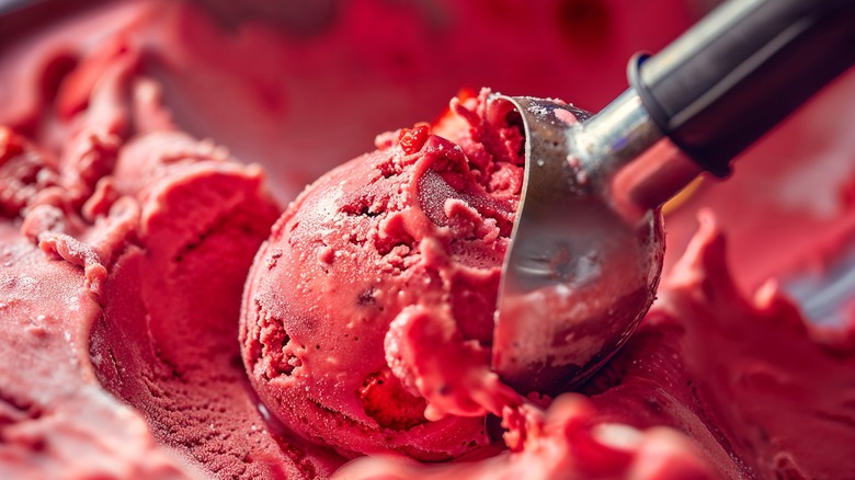 Scooping strawberry ice cream