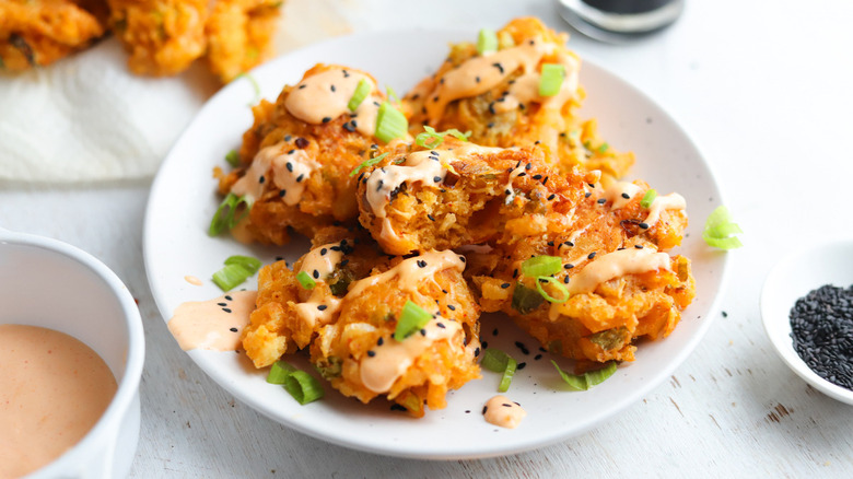 fritters with sauce and seeds