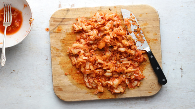 chopped kimchi on wooden board