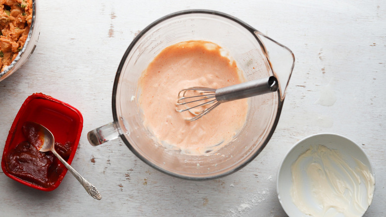 pink sauce in clear cup