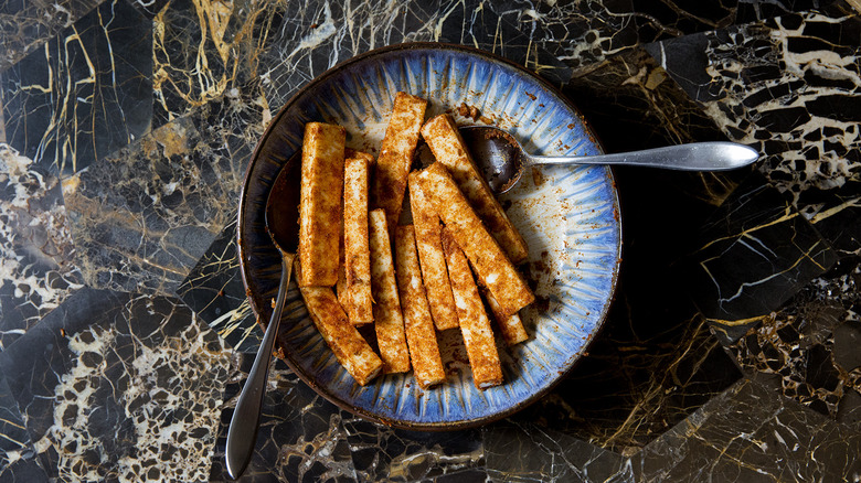 coated paneer sticks in dish