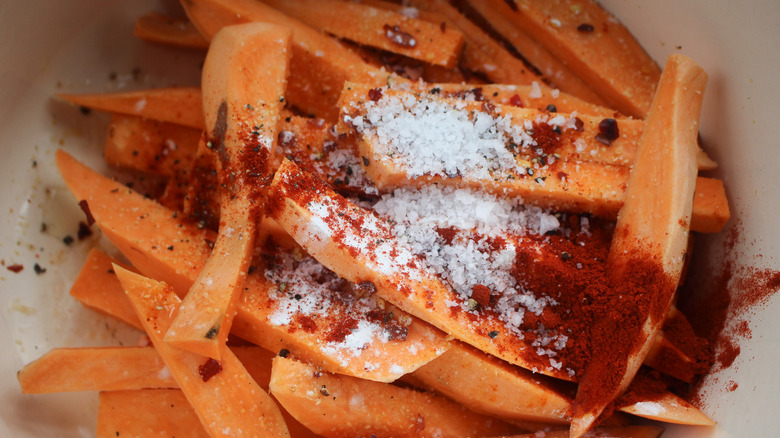 spices on top of sweet potato spears