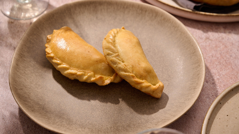 folded empanada on plate