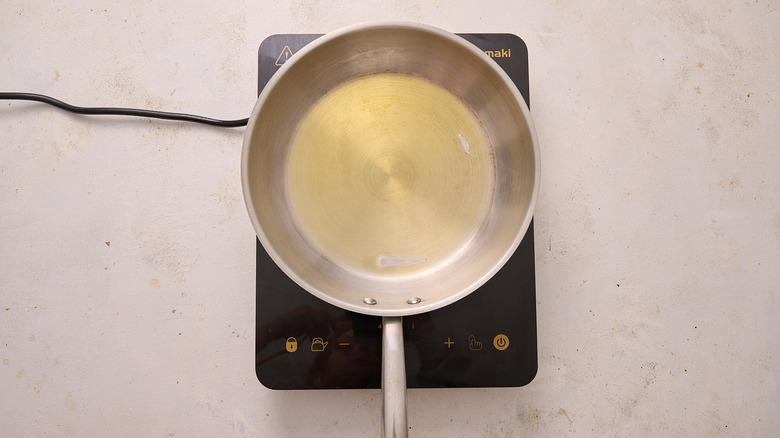 heating oil in a skillet