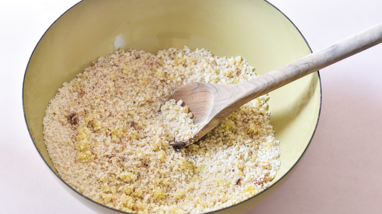 stirring breadcrumbs and seasonings