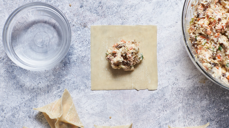 wonton with filling on table