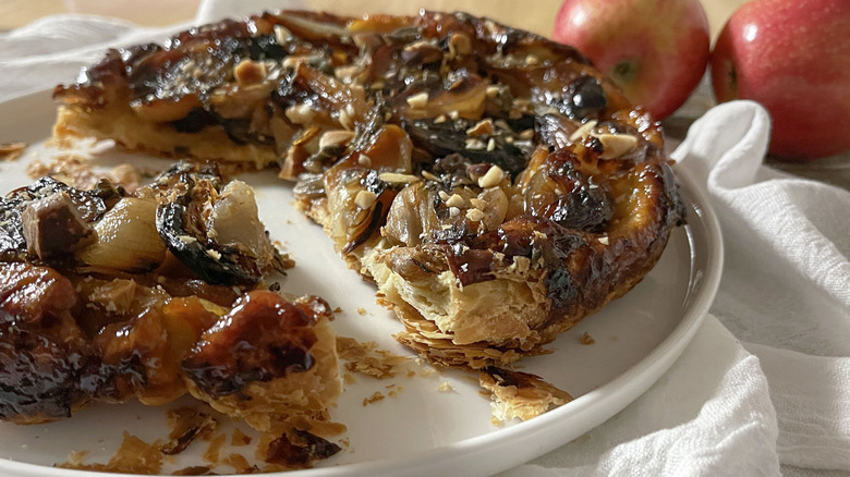 savory shallot tarte tatin on white plate