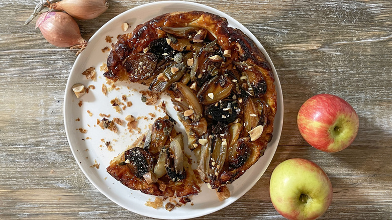 savory shallot tarte tatin on white plate