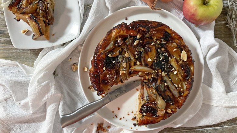 savory shallot tarte tatin on white plate