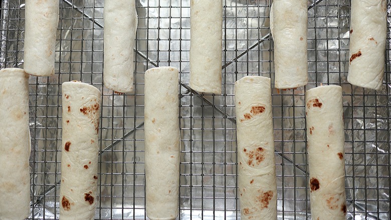 rolled flour tortillas on rack