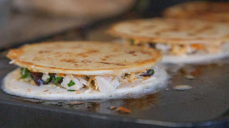 quesadillas cooking on skillet