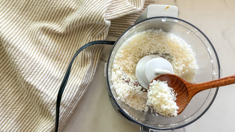 wooden spoon with ground coconut