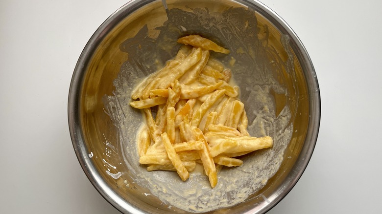 sliced rutabaga in metal bowl