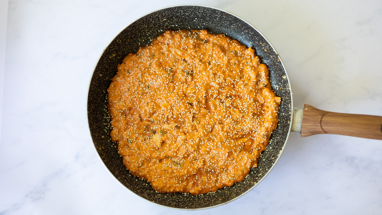 kimchi pancake cooking in skillet