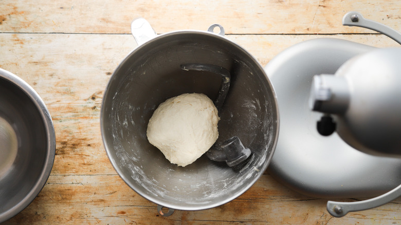 Pizza dough forming in bowl