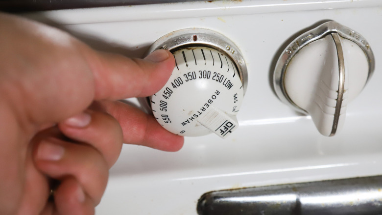 Hand turning oven dial