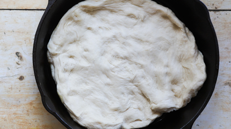 Dough resting in iron pan