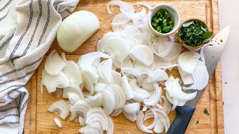 sliced onions on cutting board