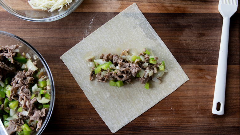 Crispy Philly cheesesteak egg rolls prep