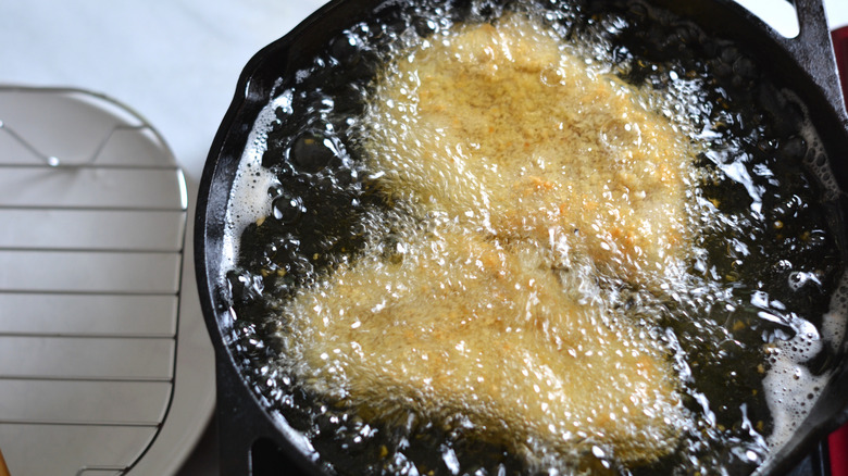 frying pork in skillet