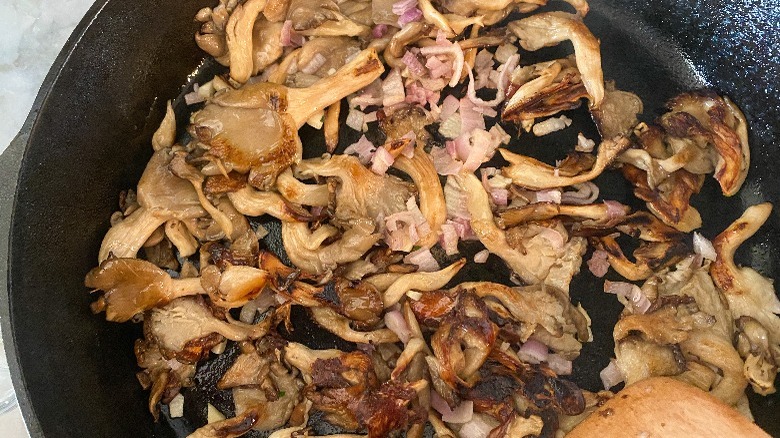 mushrooms and shallots in skillet