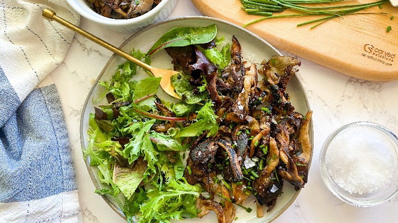 mushrooms and salad on plate