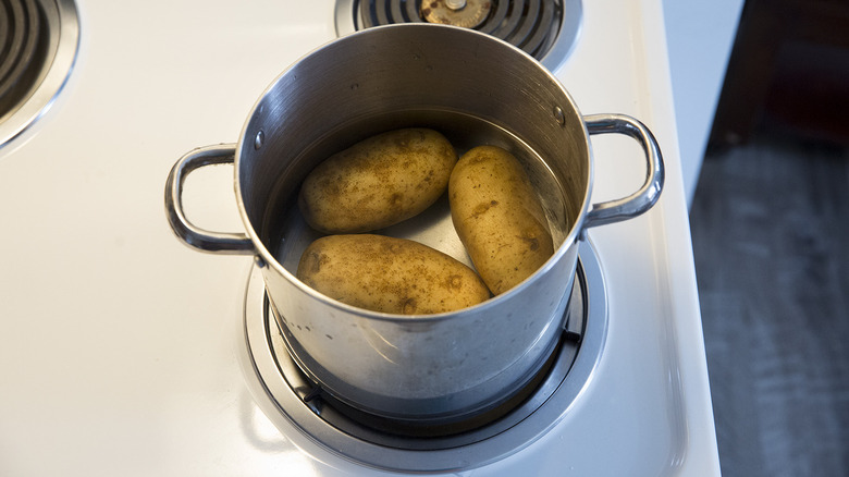 potatoes in pot of water