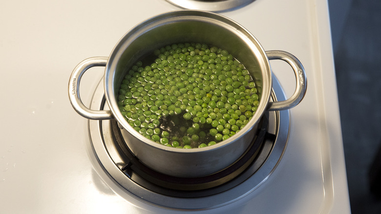 peas cooking in small pot