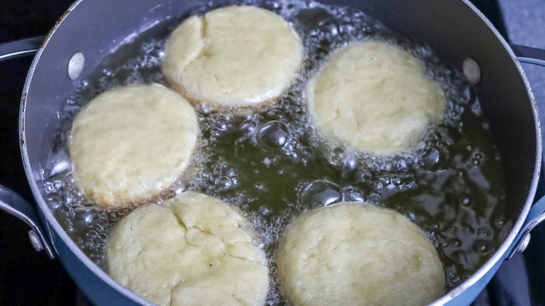 dough rounds in hot oil