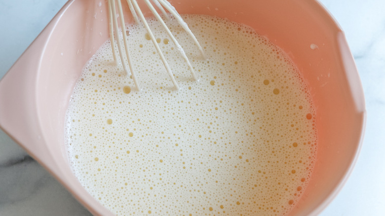 milk and eggs in bowl