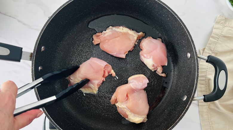 chicken thighs searing one side