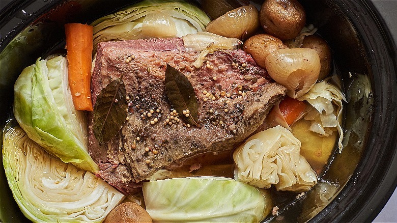 cooked brisket with cabbage in slow cooker