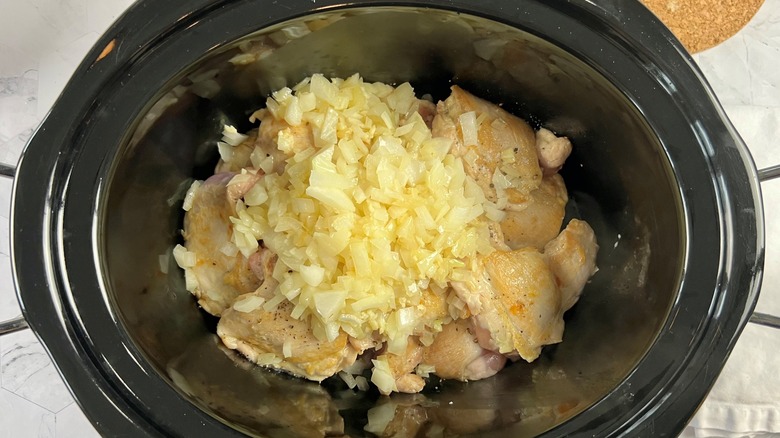 chicken and onions in pot