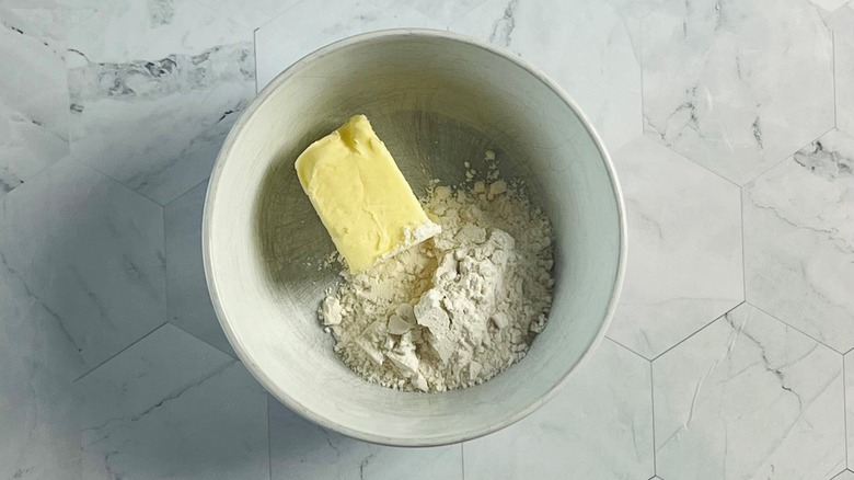 Butter and flour in white bowl
