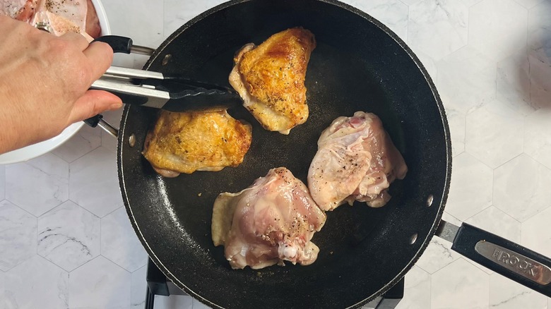 Browned chicken in a sauté pan