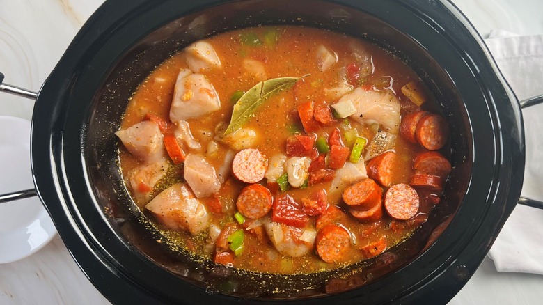 gumbo with seasonings in pot